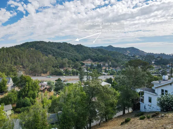 an aerial view of a house with a lake view