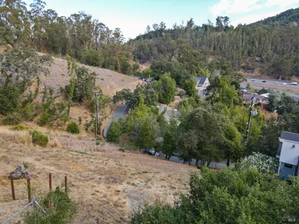 an aerial view of a house with mountain view