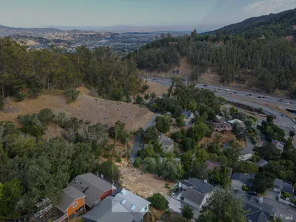 an aerial view of city and mountain