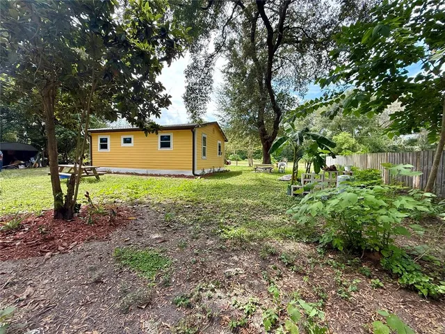 a view of backyard with green space