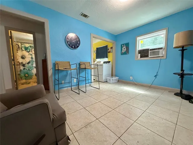 a view of a livingroom with furniture and window