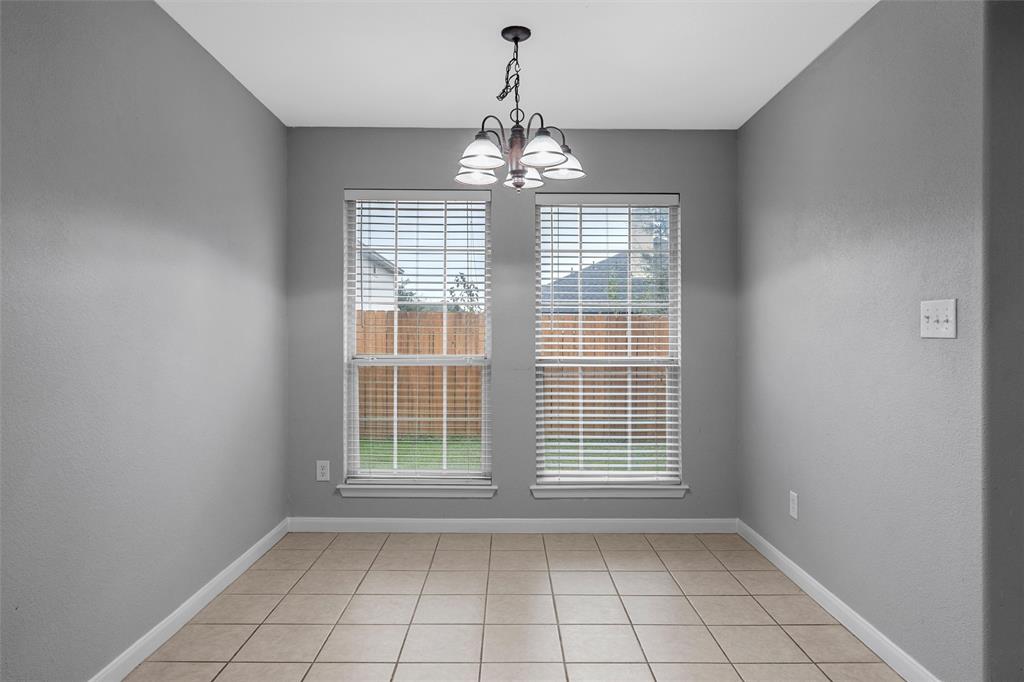 10121 Colony Drive Waco, TX 76708 - Photo 6 of 19 a view of an empty room with a window