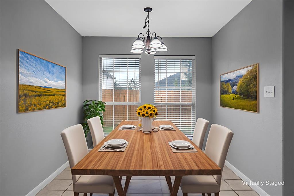 10121 Colony Drive Waco, TX 76708 - Photo 7 of 19 a view of a dining room with furniture wooden floor and chandelier