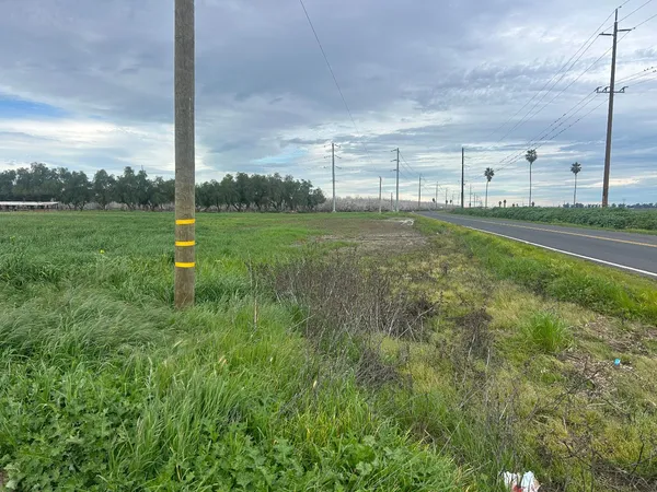 a view of a field with sitting area