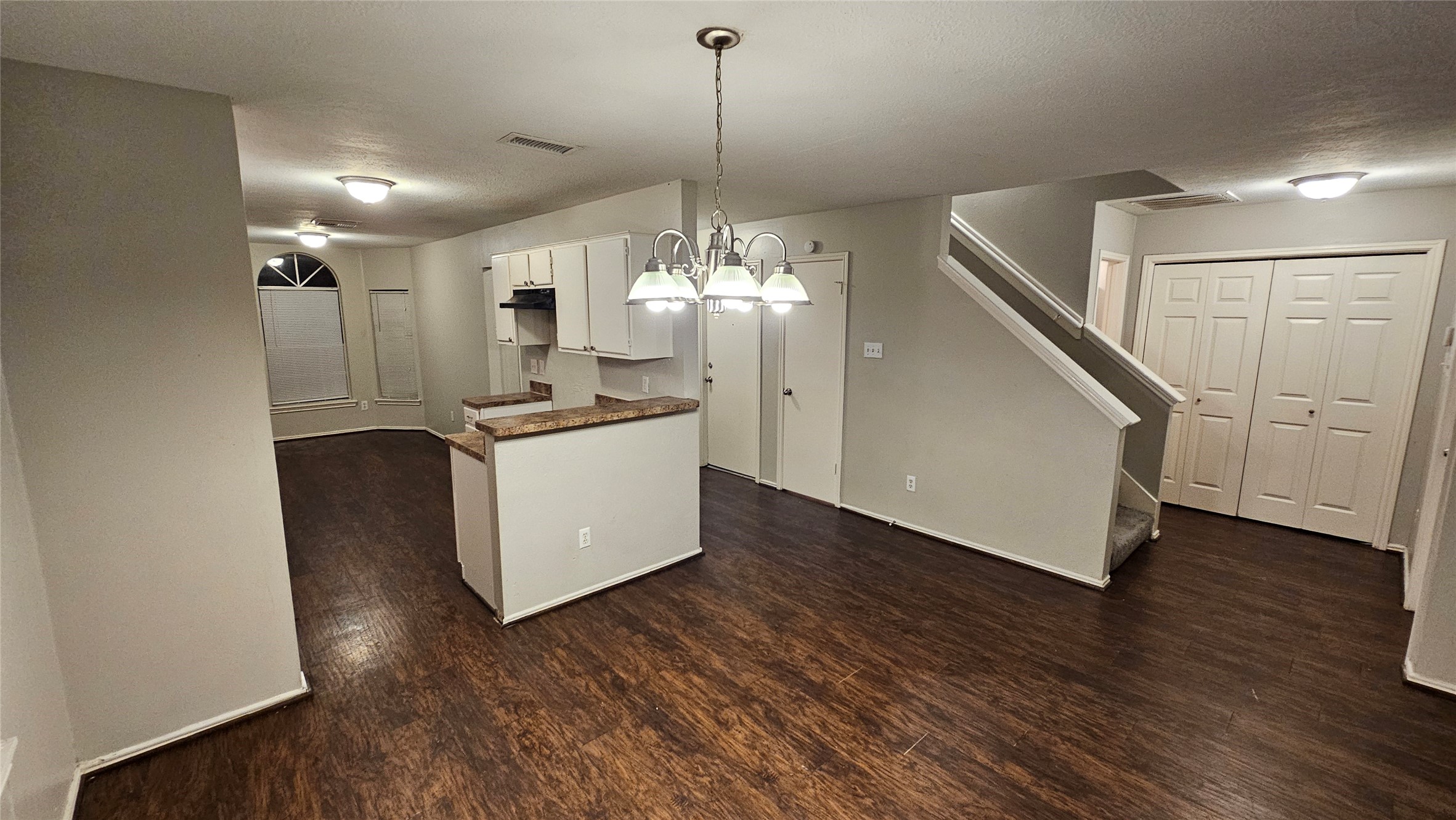 3602 Red Fir Drive Houston, TX 77088 - Photo 7 of 21 a kitchen with kitchen island stainless steel appliances a chandelier and wooden floor