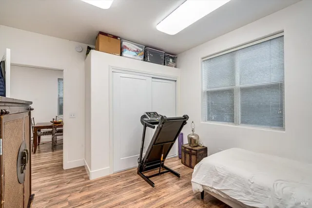 a bedroom with furniture and windows