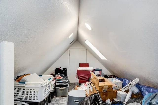a living room with furniture a rug and a window