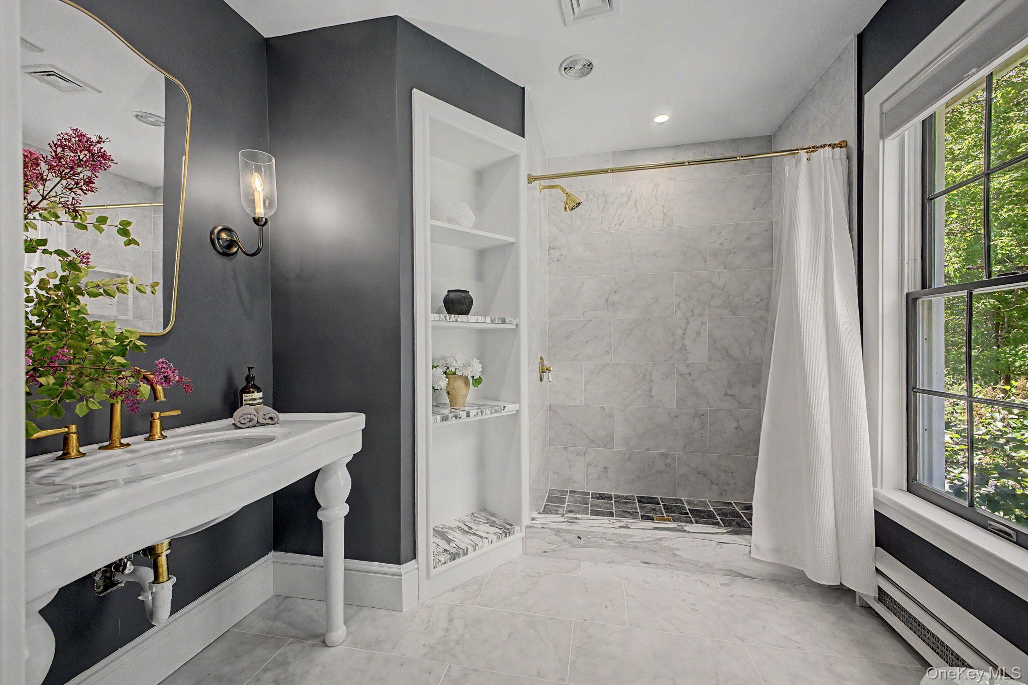 240 Eastwoods Road Pound Ridge, NY 10576 - Photo 33 of 46 a bathroom with a sink and a mirror