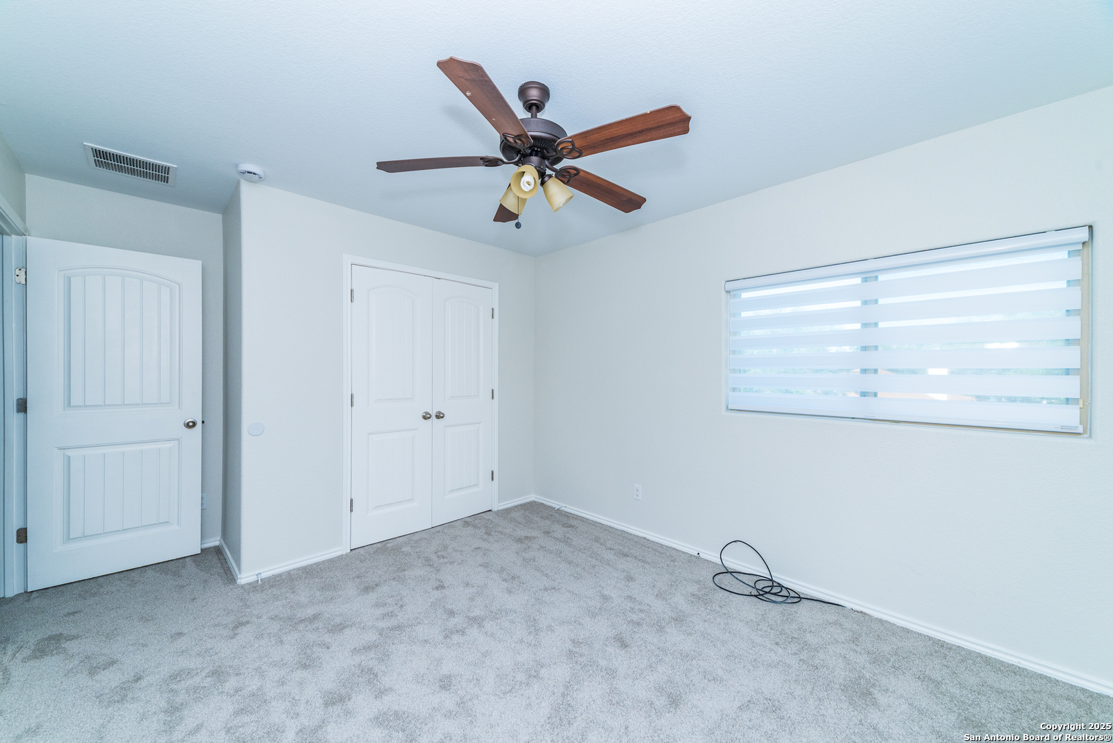 7735 Brisbane Bend Converse, TX 78109 - Photo 12 of 15 a view of a room with air conditioner and ceiling fan