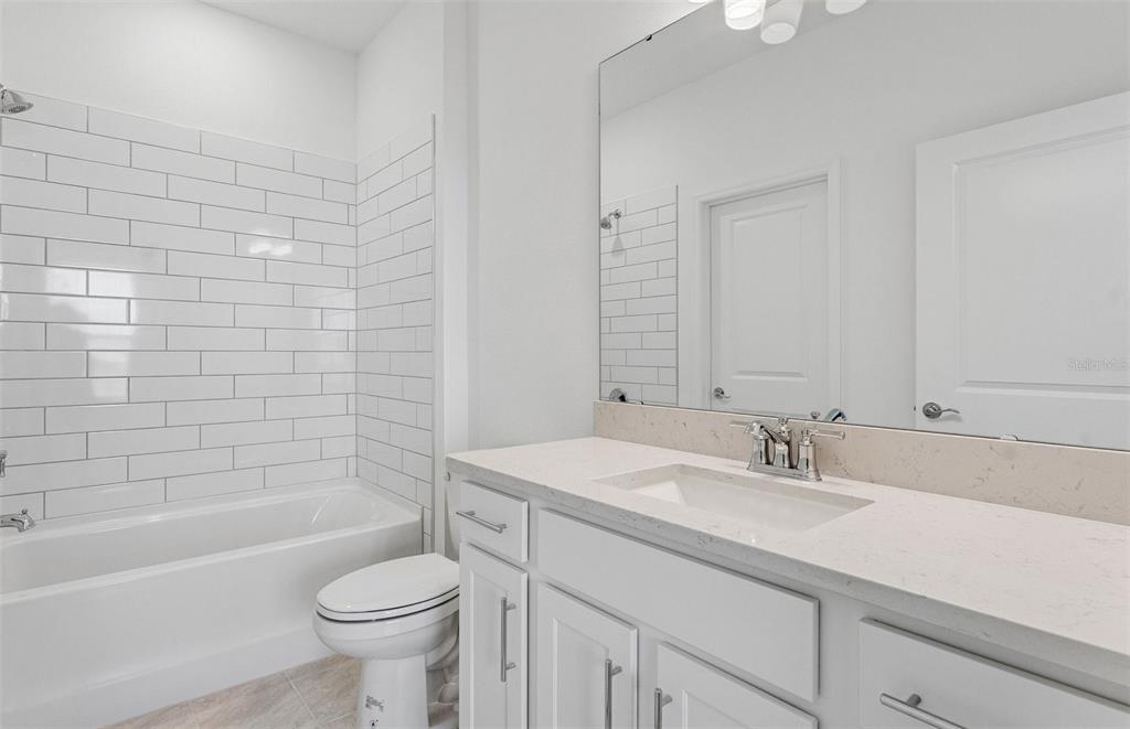 1691 Ruby Ln Lake Lake Alfred, FL 33850 - Photo 11 of 34 a bathroom with a sink toilet vanity and bathtub