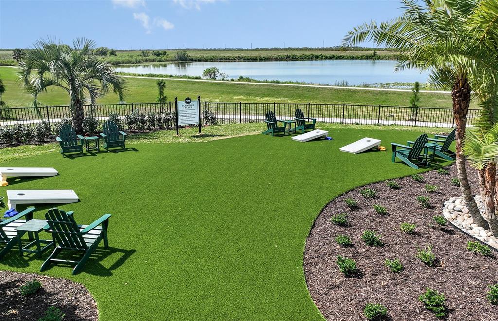1691 Ruby Ln Lake Lake Alfred, FL 33850 - Photo 28 of 34 a view of a swimming pool with a garden and trees