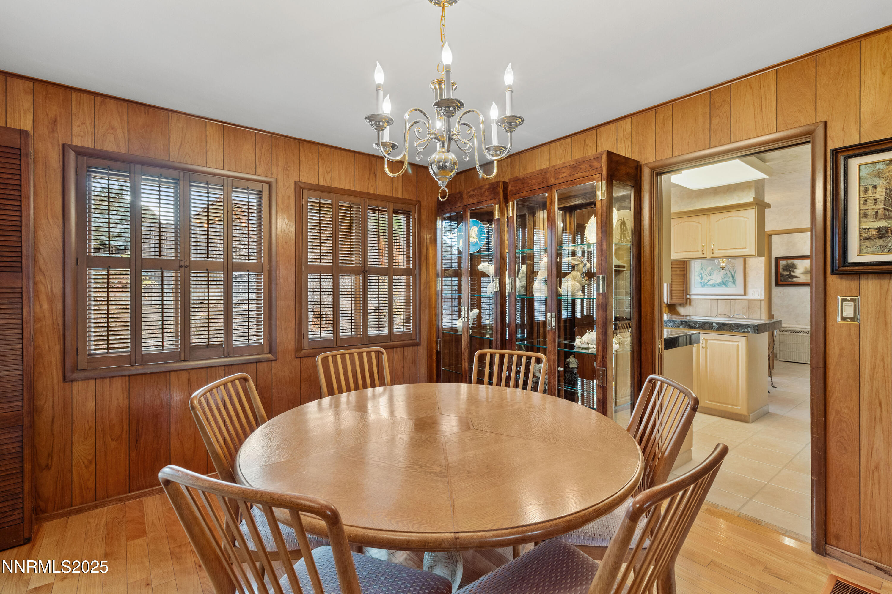 1885 Solari Drive Reno, NV 89509 - Photo 17 of 52 a dining room with furniture a chandelier and window