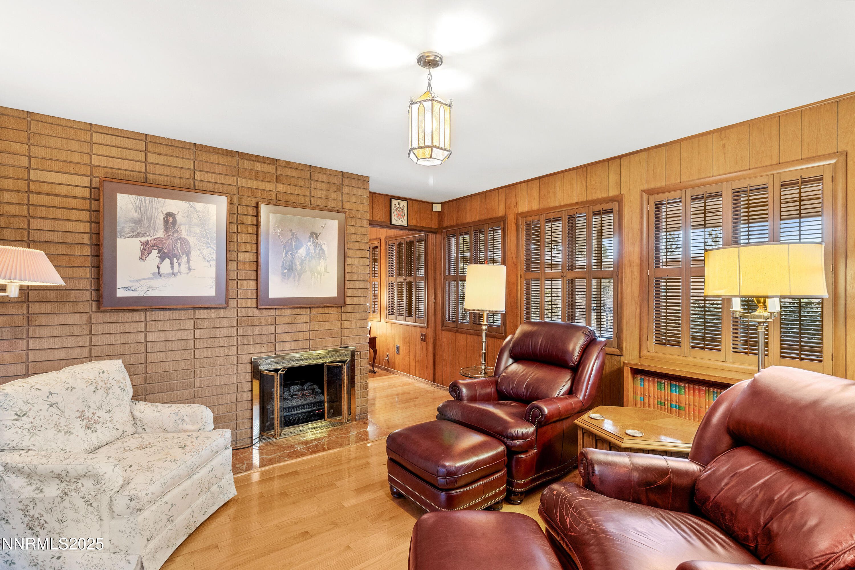 1885 Solari Drive Reno, NV 89509 - Photo 18 of 52 a living room with furniture a fireplace and a large window
