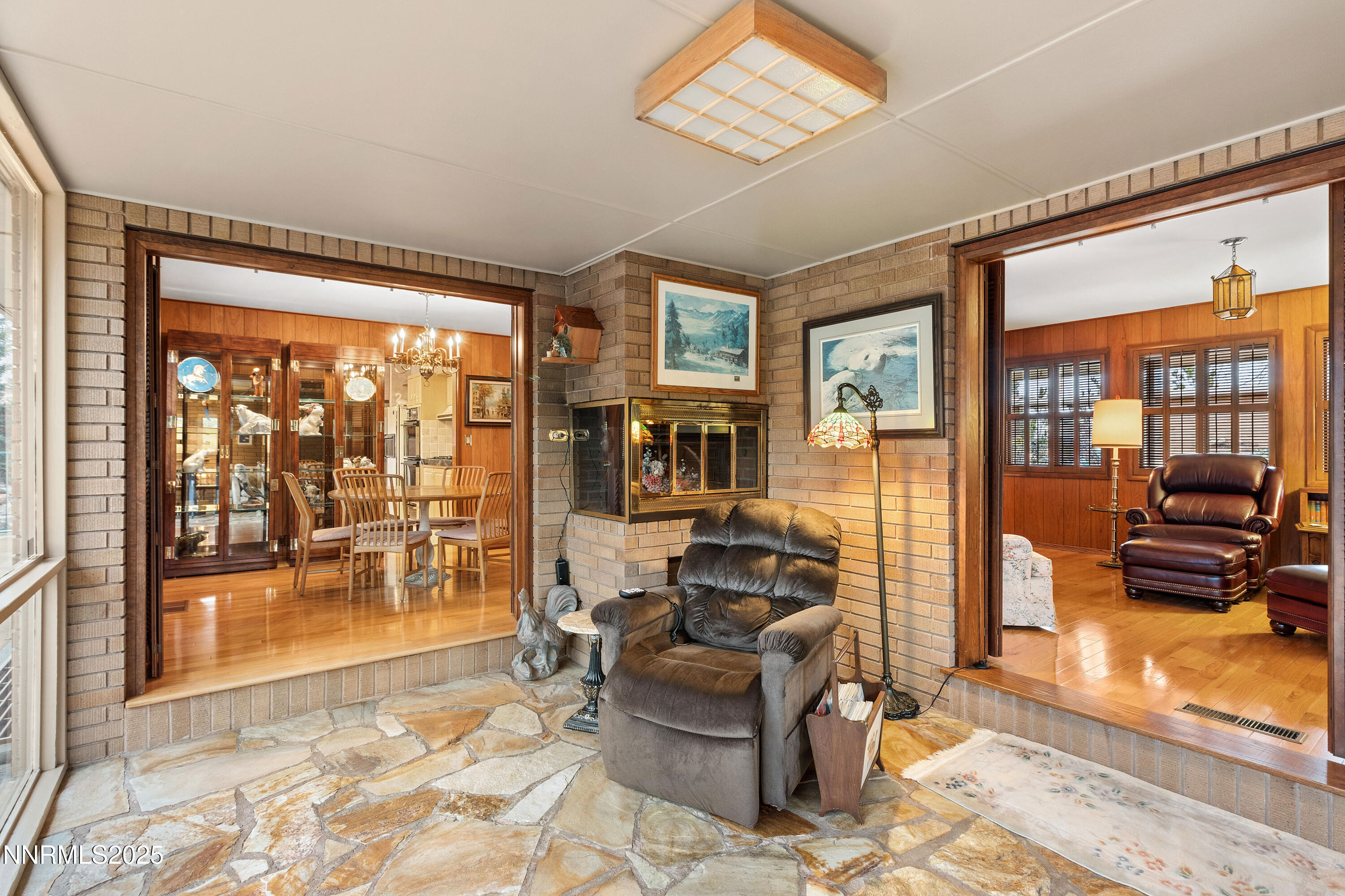 1885 Solari Drive Reno, NV 89509 - Photo 19 of 52 a living room with furniture and a floor to ceiling window