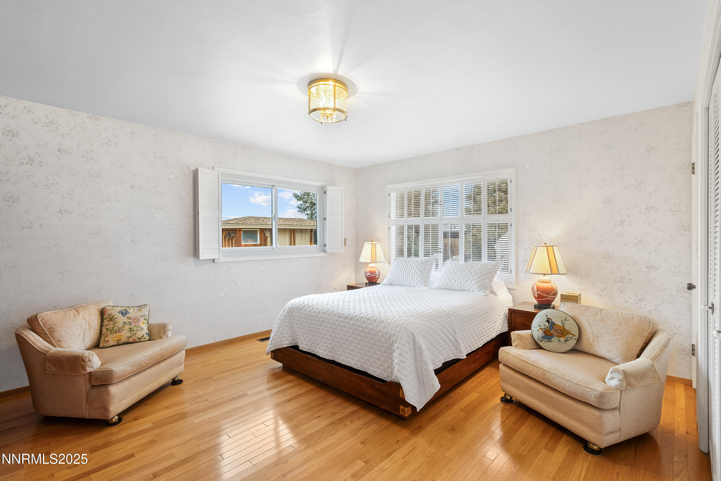 1885 Solari Drive Reno, NV 89509 - Photo 21 of 52 a bedroom with a bed and a couch