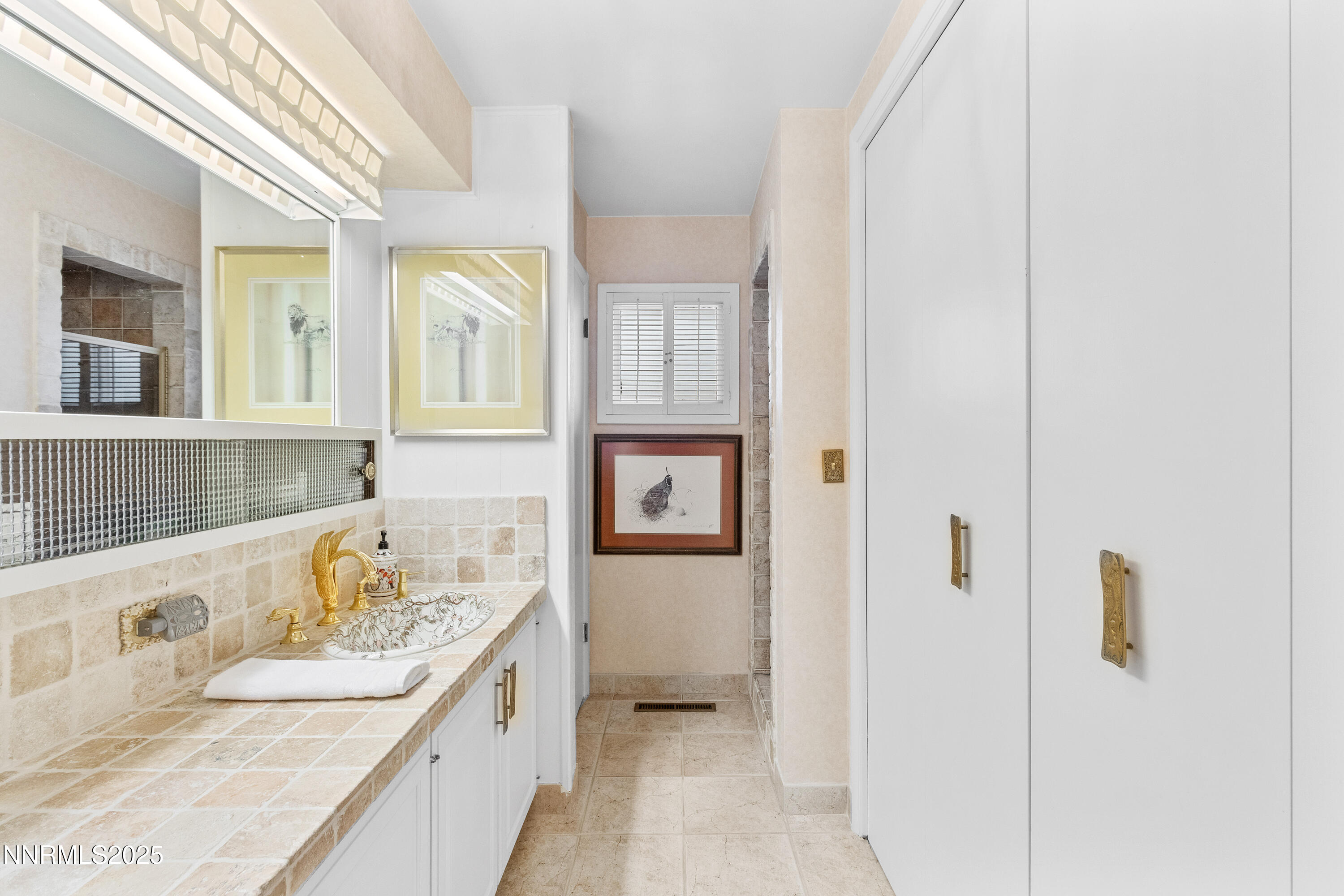 1885 Solari Drive Reno, NV 89509 - Photo 23 of 52 a bathroom with a tub sink and mirror