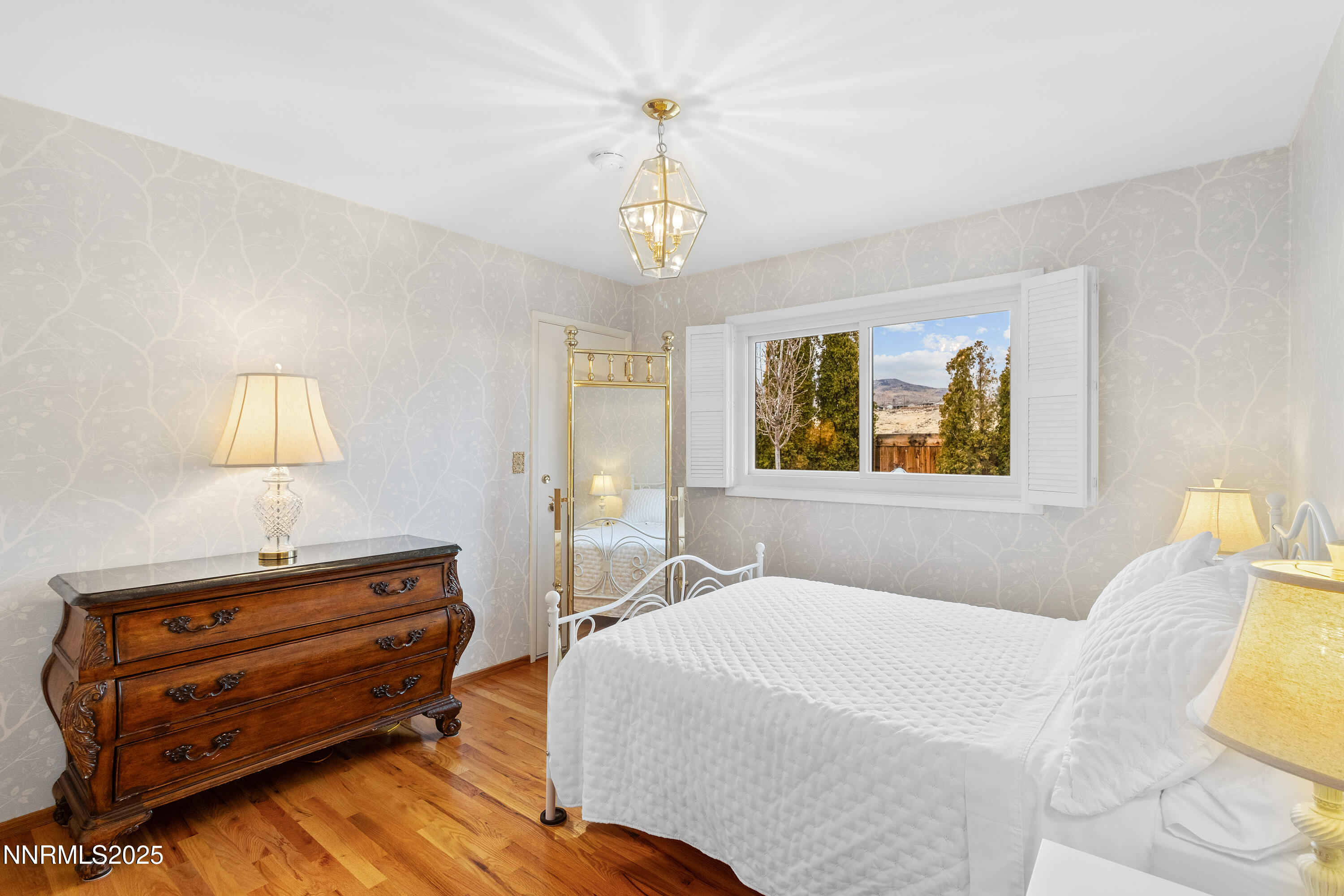 1885 Solari Drive Reno, NV 89509 - Photo 24 of 52 a bedroom with a bed dresser and a window