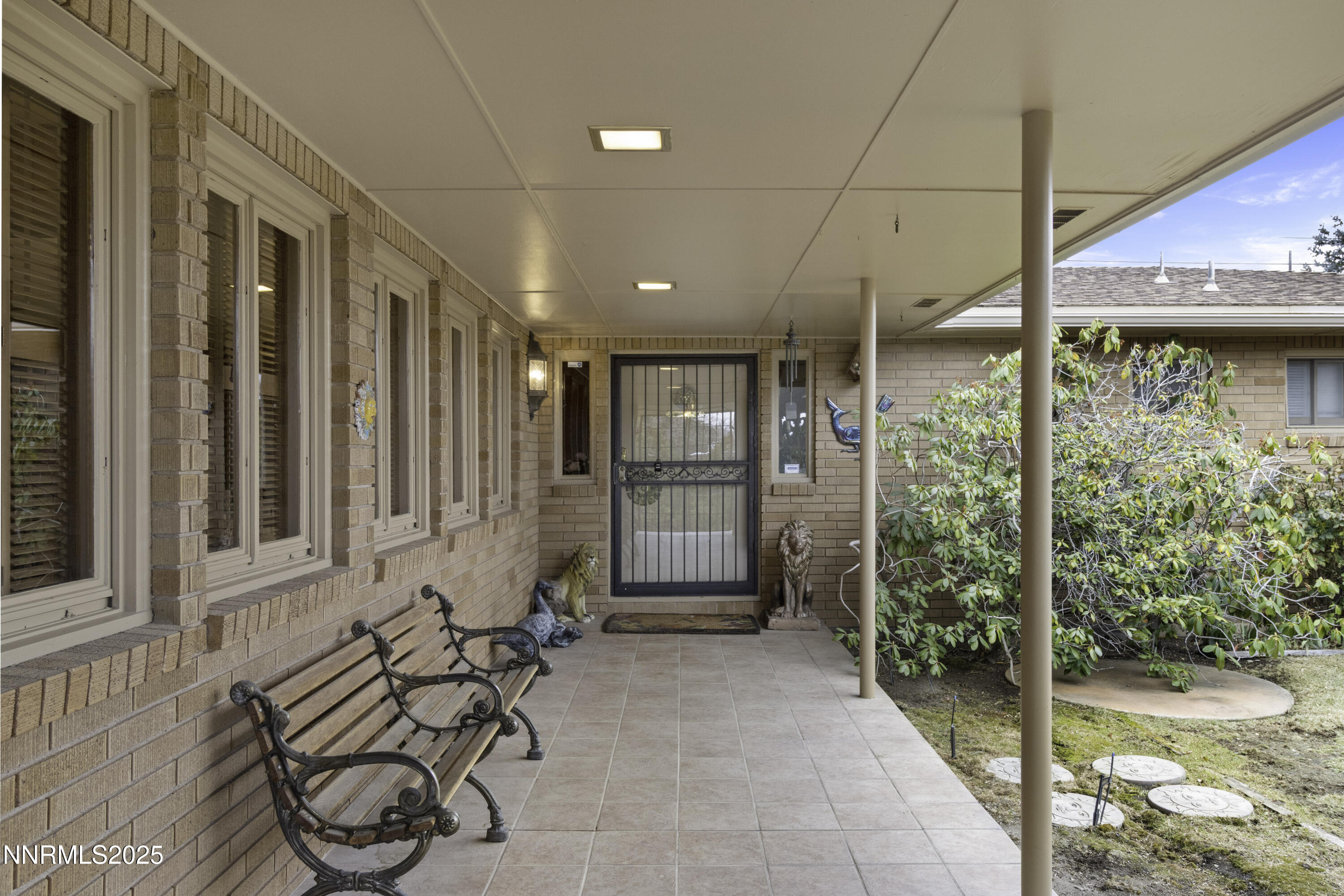1885 Solari Drive Reno, NV 89509 - Photo 3 of 52 a view of a porch with chairs and front door