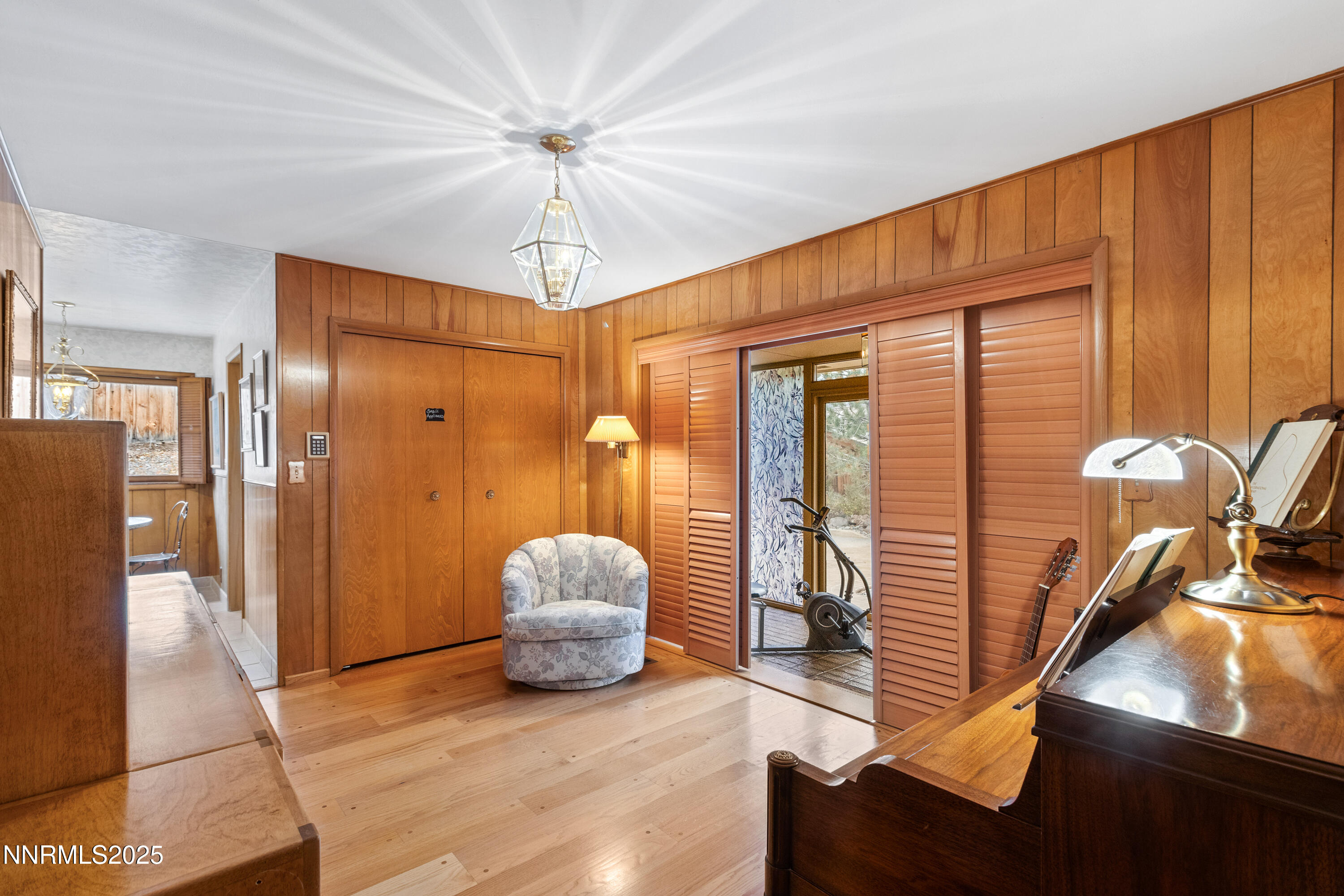 1885 Solari Drive Reno, NV 89509 - Photo 6 of 52 a living room with furniture rug and a chandelier