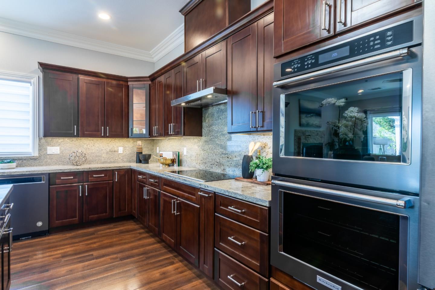 1258 South Stelling Road Cupertino, CA 95014 - Photo 12 of 56 a kitchen with sink cabinets and stainless steel appliances