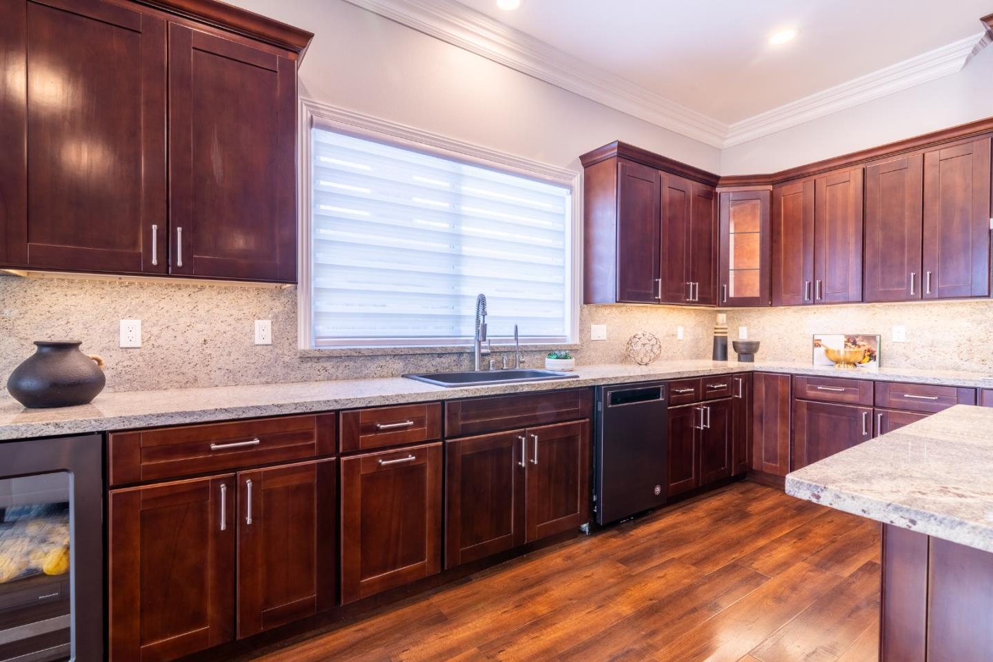 1258 South Stelling Road Cupertino, CA 95014 - Photo 14 of 56 a kitchen with granite countertop wooden cabinets and sink