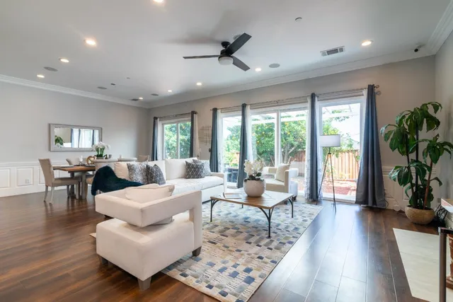 a living room with furniture fireplace and a view