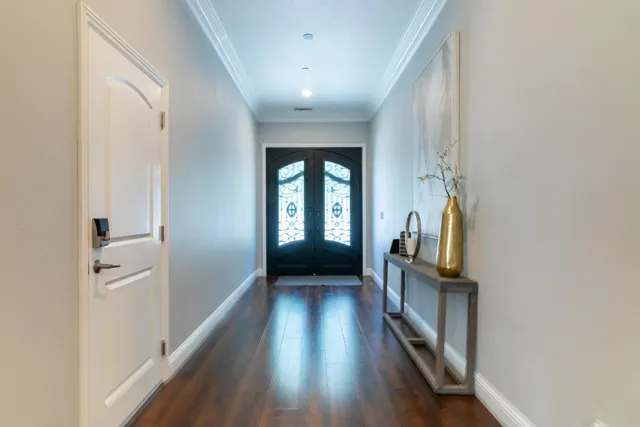 a large kitchen with stainless steel appliances kitchen island granite countertop a large island in the center