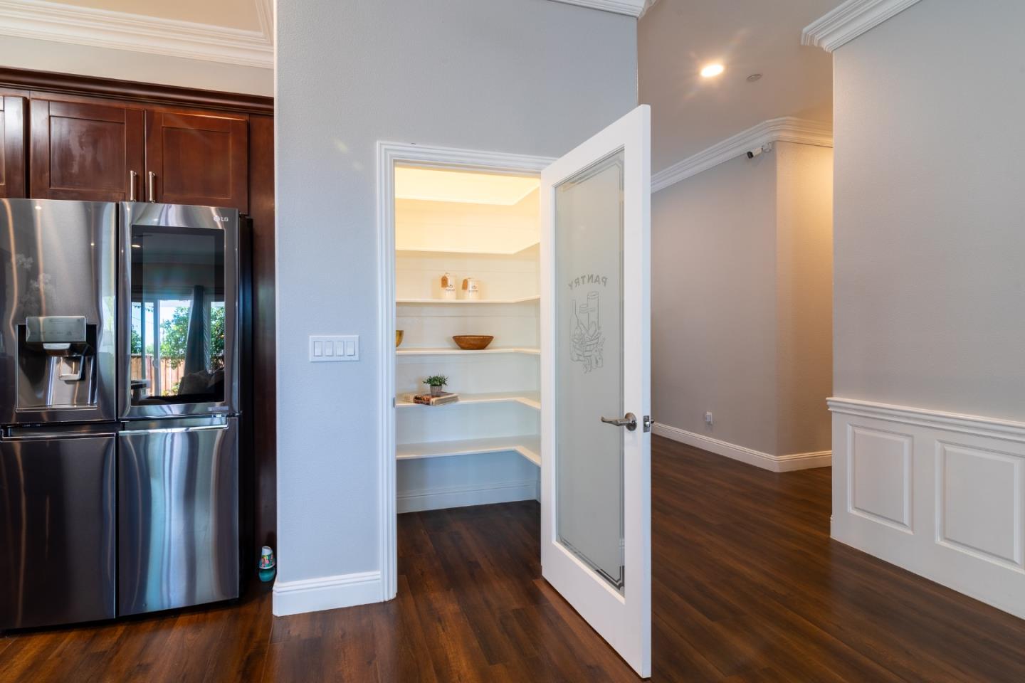 1258 South Stelling Road Cupertino, CA 95014 - Photo 22 of 56 an empty room with wooden floor mirror and windows
