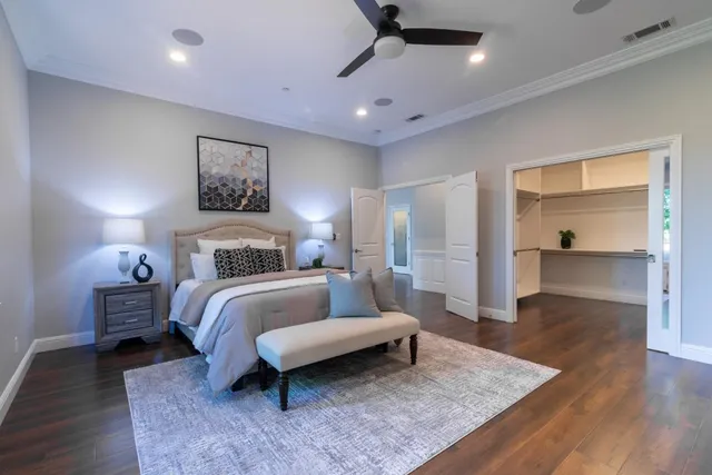 a bedroom with a bed and a lamp