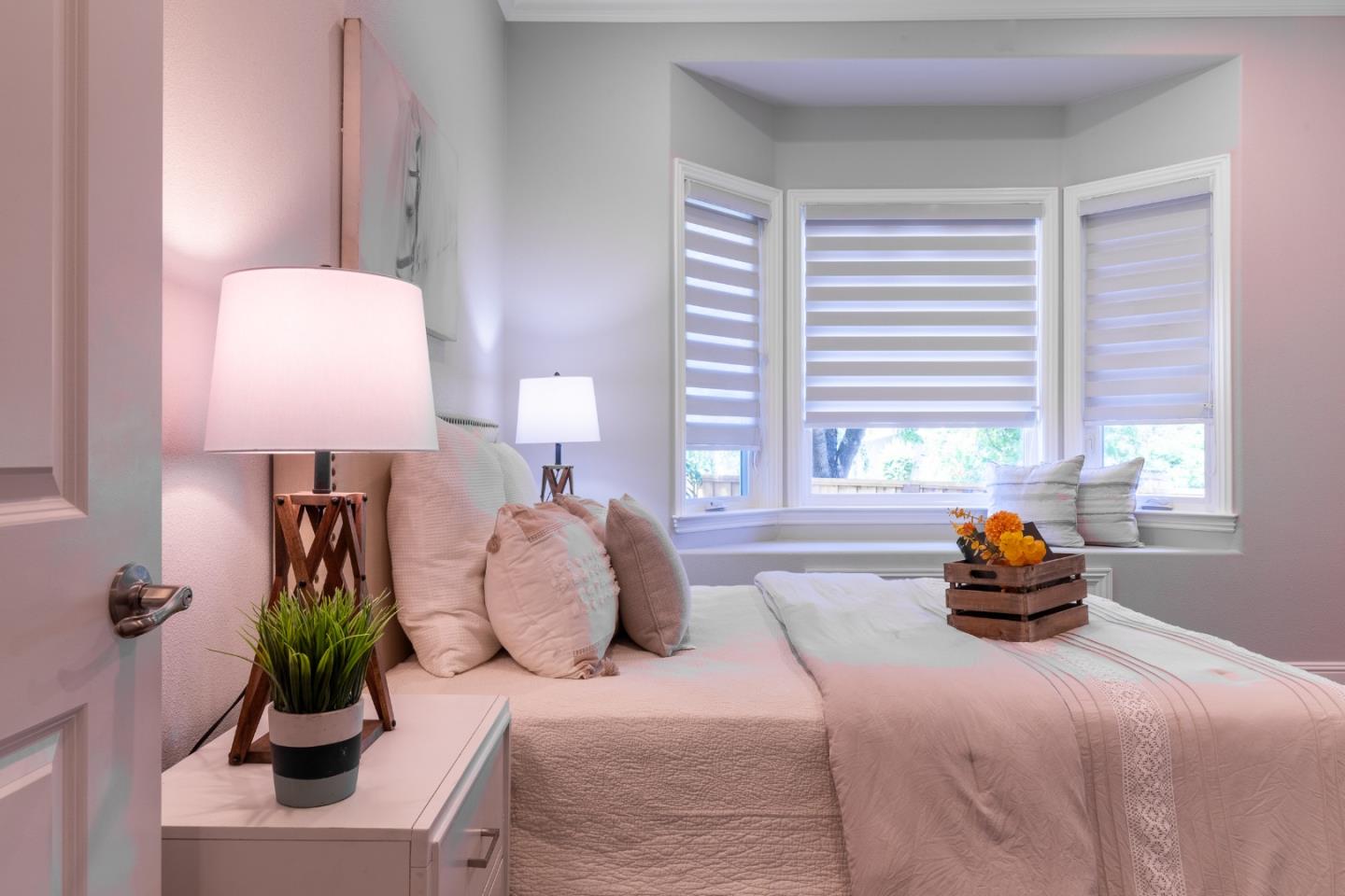 1258 South Stelling Road Cupertino, CA 95014 - Photo 29 of 56 a bedroom with a bed and a lamp