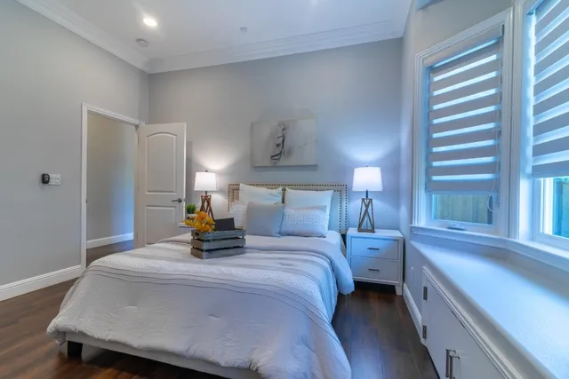 a bedroom with a bed and a lamp