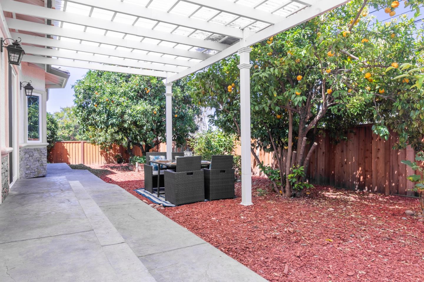 1258 South Stelling Road Cupertino, CA 95014 - Photo 36 of 56 a view of a patio with furniture and a yard