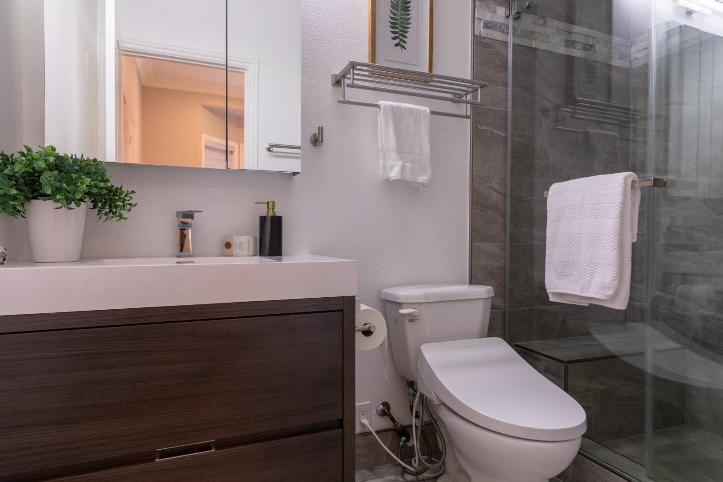 1258 South Stelling Road Cupertino, CA 95014 - Photo 43 of 56 a bathroom with a toilet a sink and mirror
