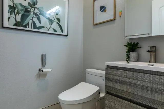 a bathroom with a double vanity sink mirror and shower