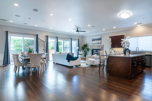 a view of a dining room with furniture and wooden floor