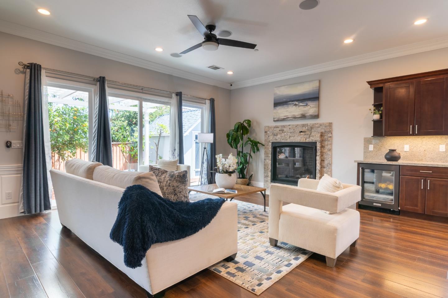 1258 South Stelling Road Cupertino, CA 95014 - Photo 8 of 56 a living room with fireplace furniture and a flat screen tv