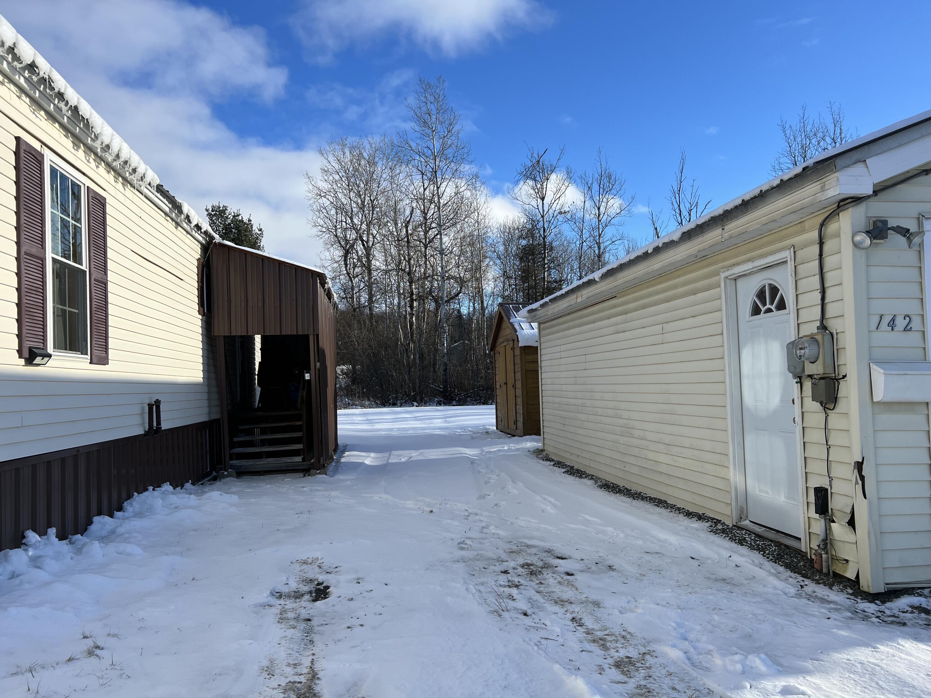 142 Chapman Road Presque Isle, ME 04769 - Photo 3 of 28 Between buildings