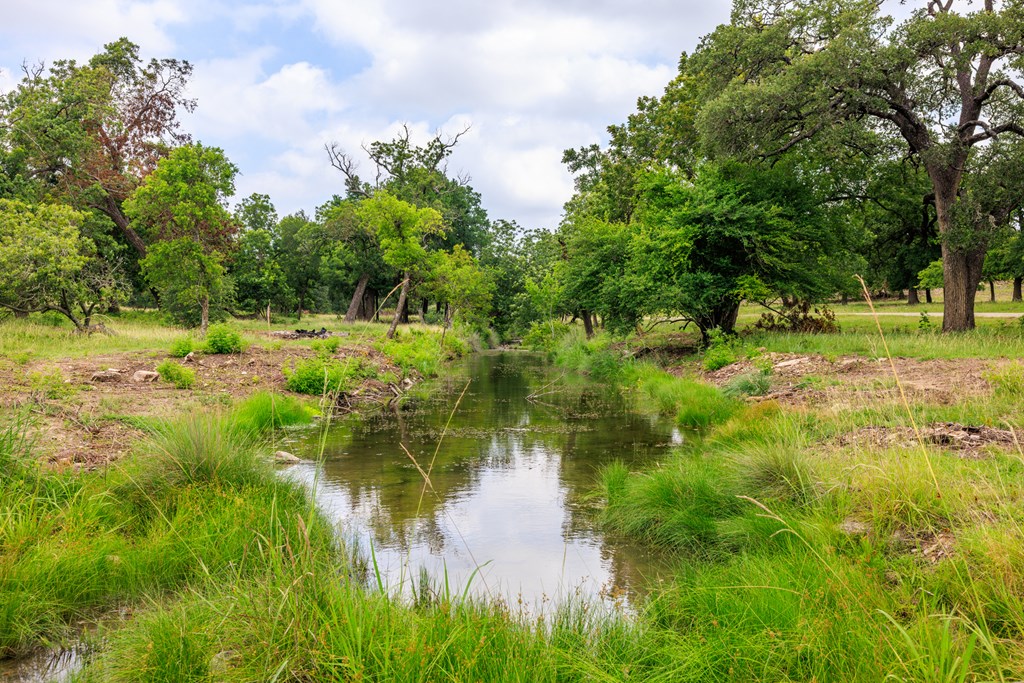 0 Loudon Road Fredericksburg, TX 78624 - Photo 4 of 7 a view of a lake view with a garden