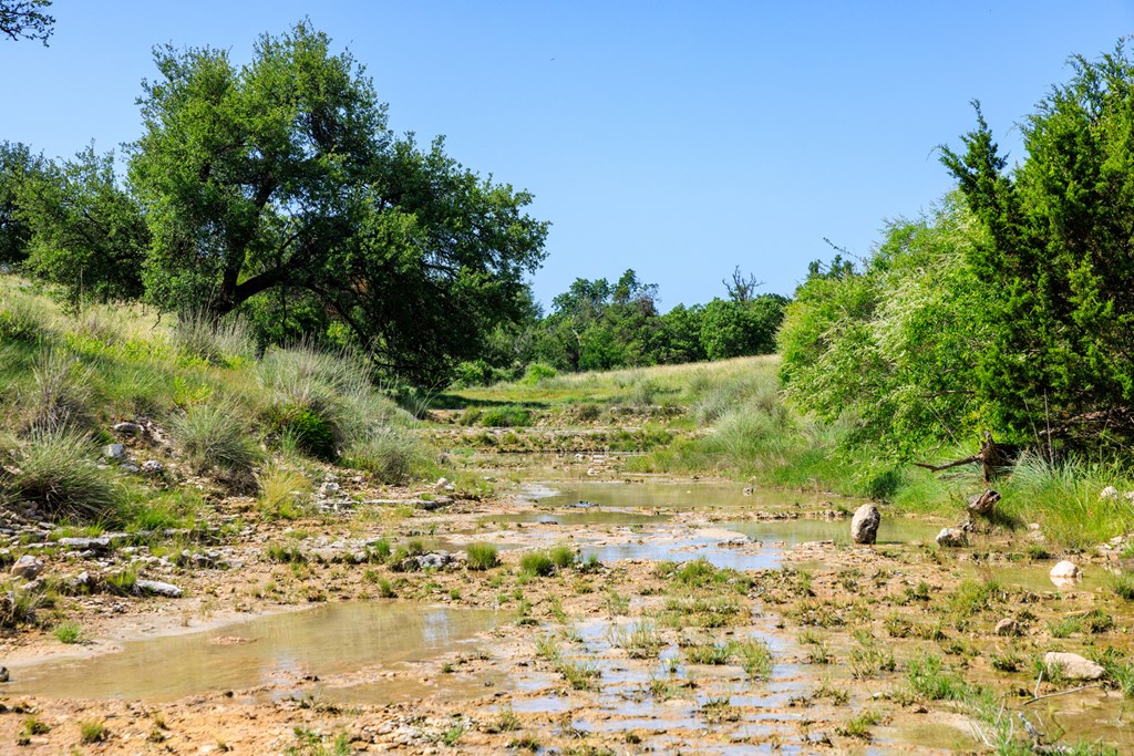 0 Loudon Road Fredericksburg, TX 78624 - Photo 6 of 7 a view of a lake with a yard