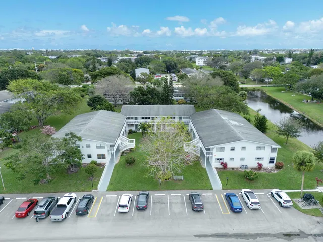 a view of an house with backyard space and balcony