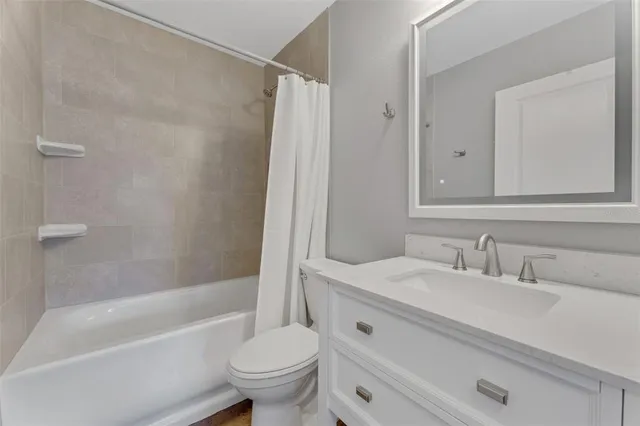 a bathroom with a sink toilet and a bathtub