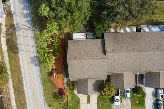 an aerial view of a house with a garden