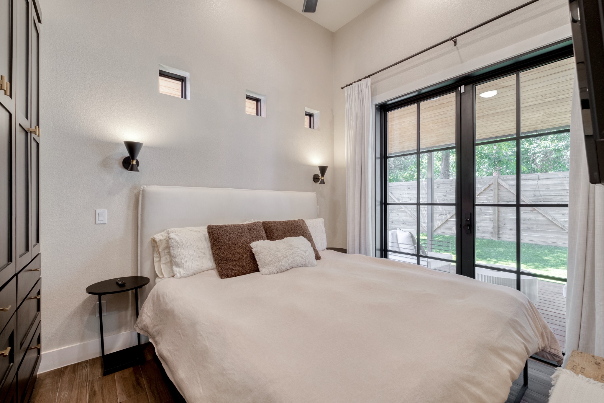 1904 East 16th Street, Unit 2 Austin, TX 78702 - Photo 13 of 20 Spacious room featuring wood-finish flooring and a large sliding glass door opening to the exterior