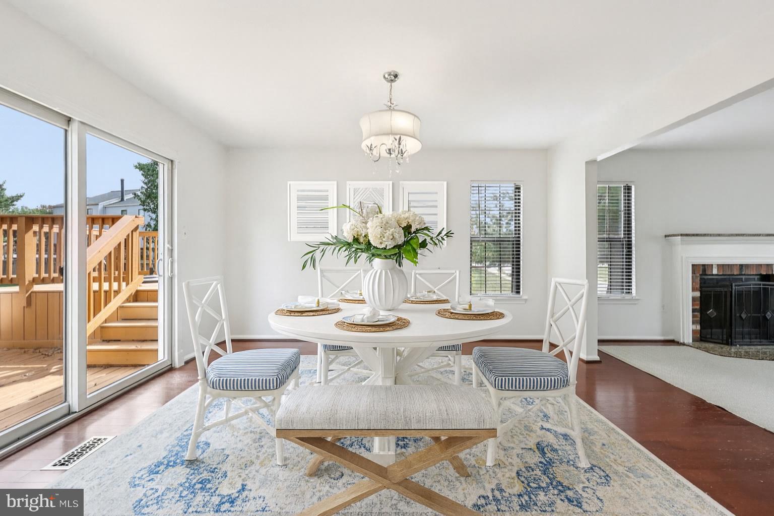 2 Berkeley Court Sterling, VA 20165 - Photo 11 of 46 a view of a dining room with furniture wooden floor and a chandelier