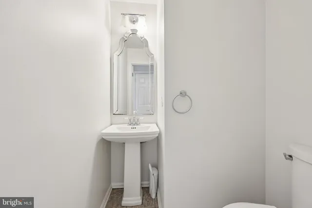 a bathroom with a sink and mirror