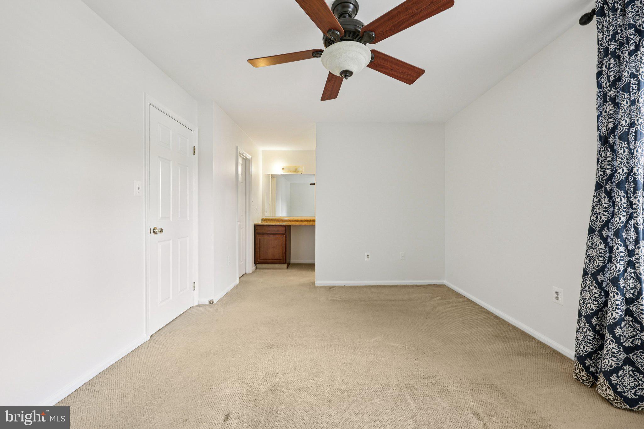 2 Berkeley Court Sterling, VA 20165 - Photo 26 of 46 an empty room with ceiling fan and window