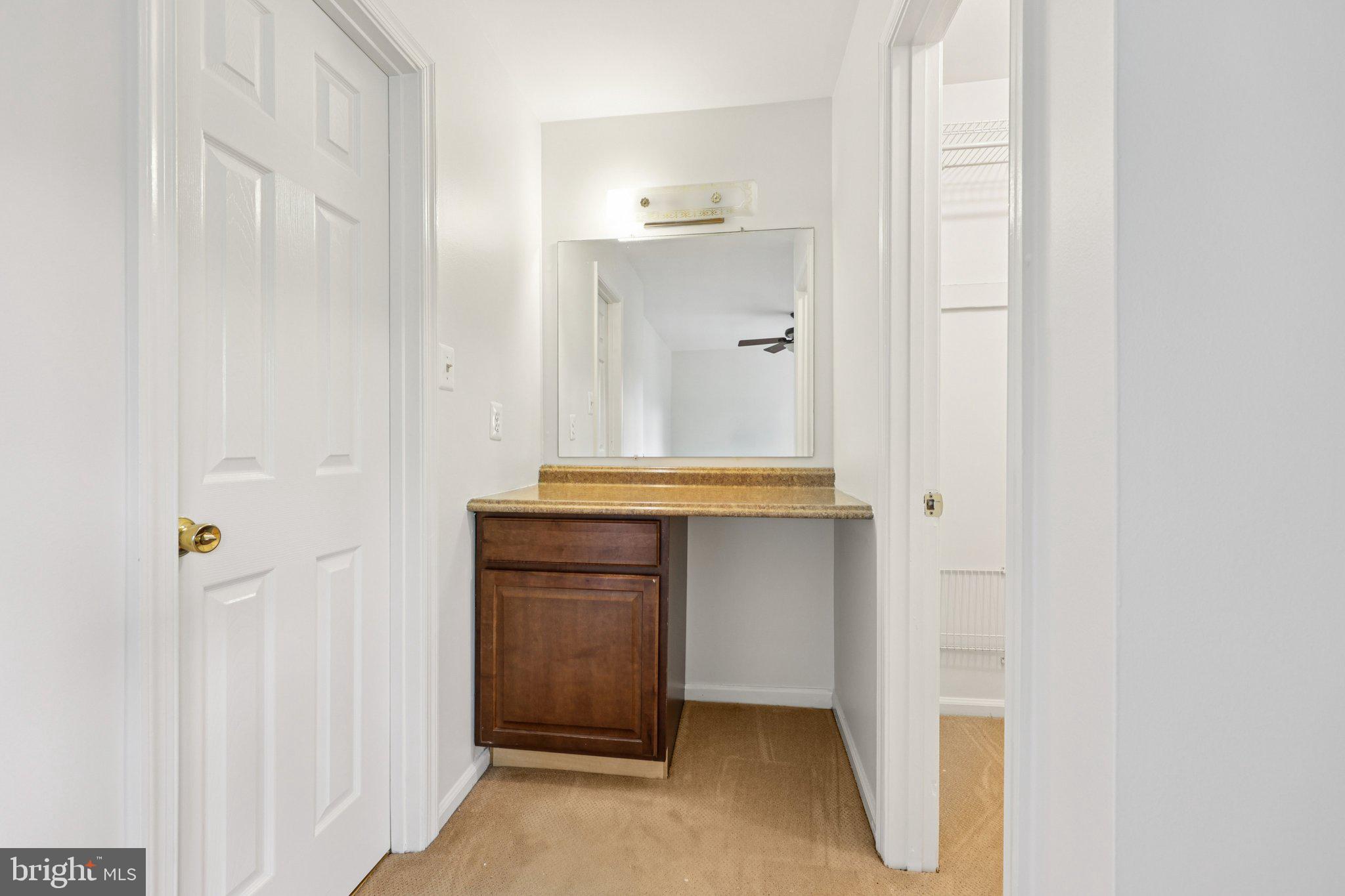 2 Berkeley Court Sterling, VA 20165 - Photo 27 of 46 a bathroom with a sink and a mirror