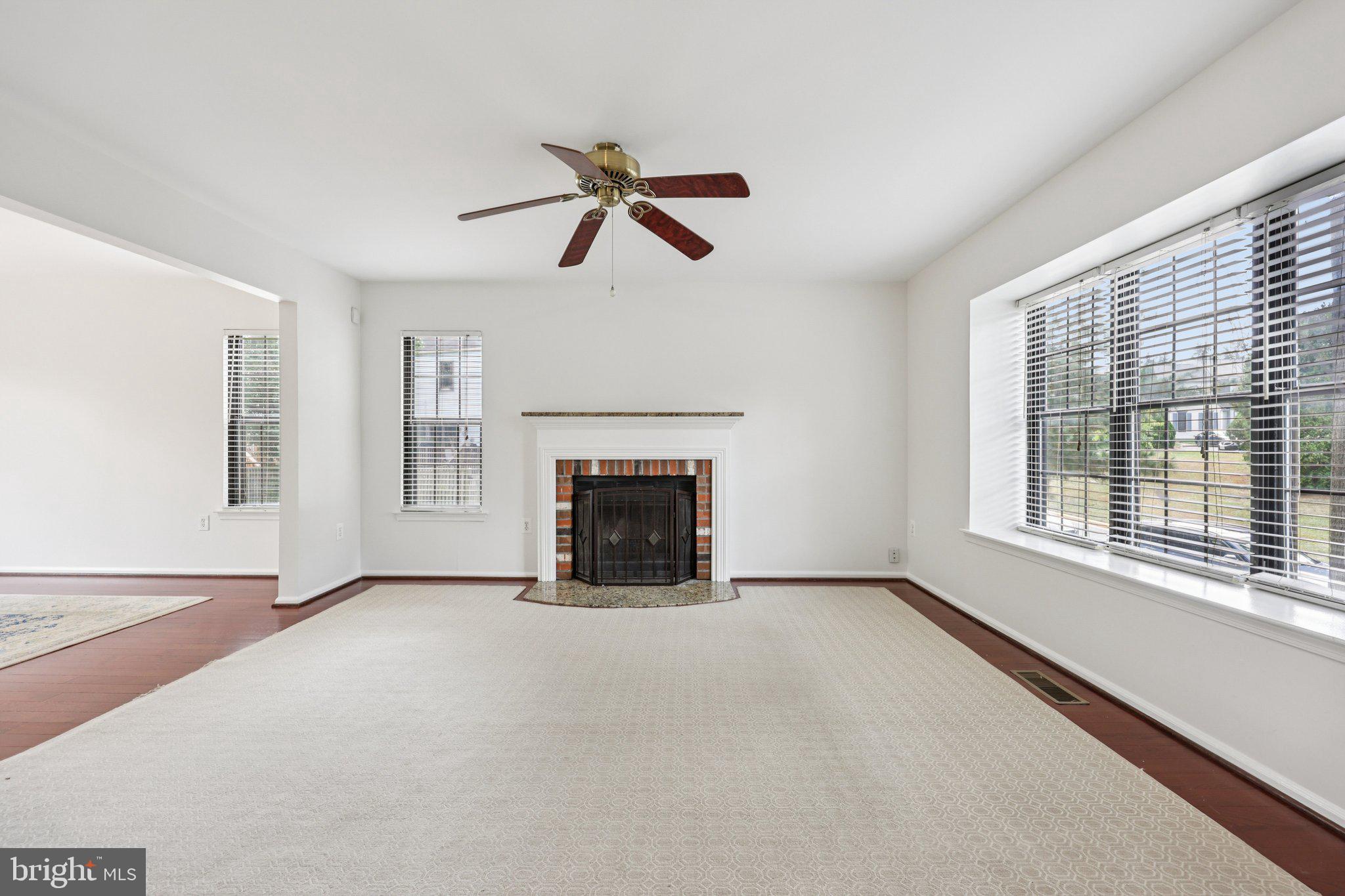 2 Berkeley Court Sterling, VA 20165 - Photo 3 of 46 a view of an empty room with a window and fireplace