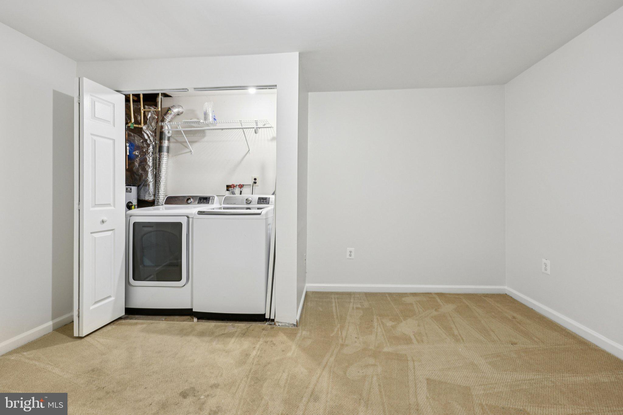 2 Berkeley Court Sterling, VA 20165 - Photo 31 of 46 a view of a kitchen with white cabinets and white appliances