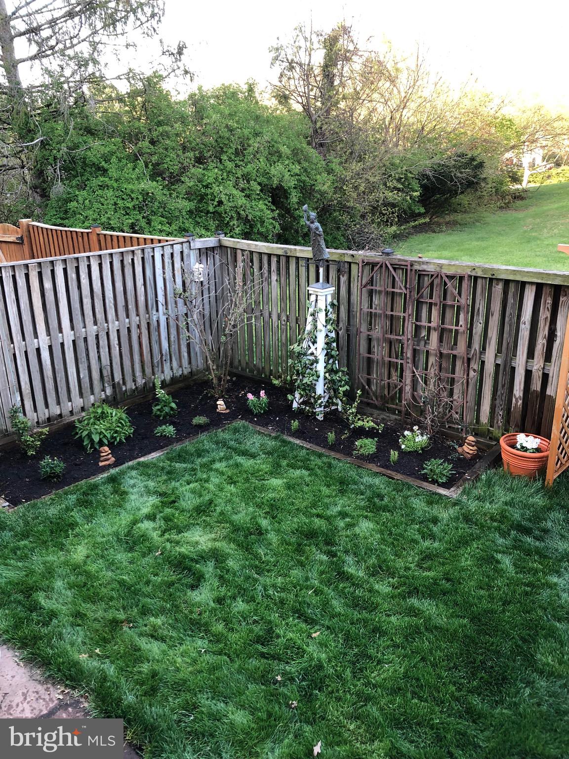 2 Berkeley Court Sterling, VA 20165 - Photo 37 of 46 a view of backyard with wooden fence and a large tree